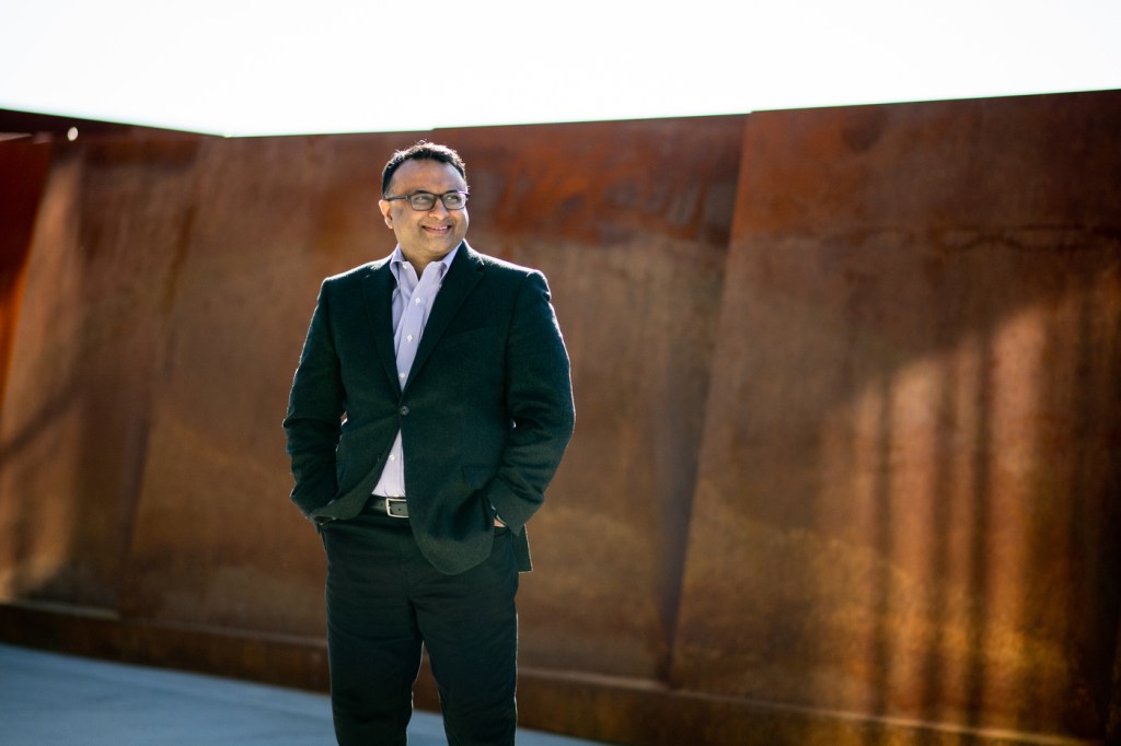 Headshot of Neil Maniar standing outside.