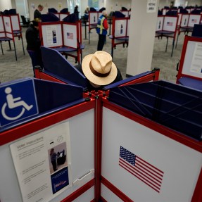 A person filling out a ballot during early voting.