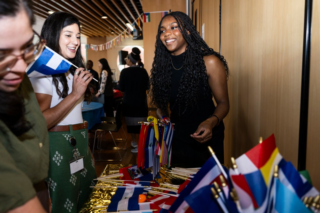 People laugh and chat at the LatinX and Hispanic Heritage Month celebration.