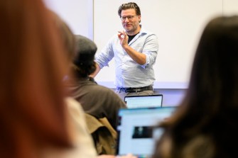 Seth Mulliken teaches about sound in front of a classroom.