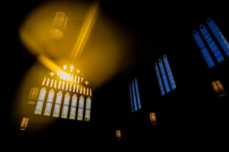 Sunlight streaming through stained glass windows at the Fenway Center.