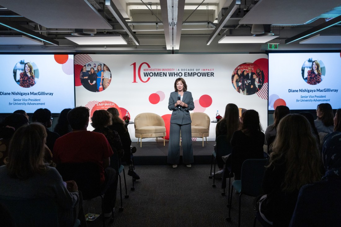 The speaker addresses the audience during the Northeastern International Day of the Girl event.