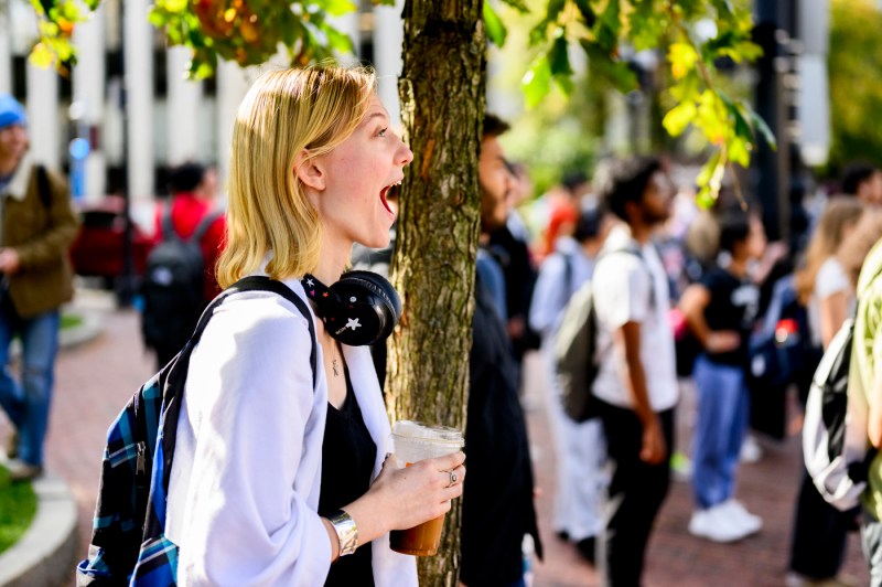 A person watching the White Hall demolition with a shocked look on their face.