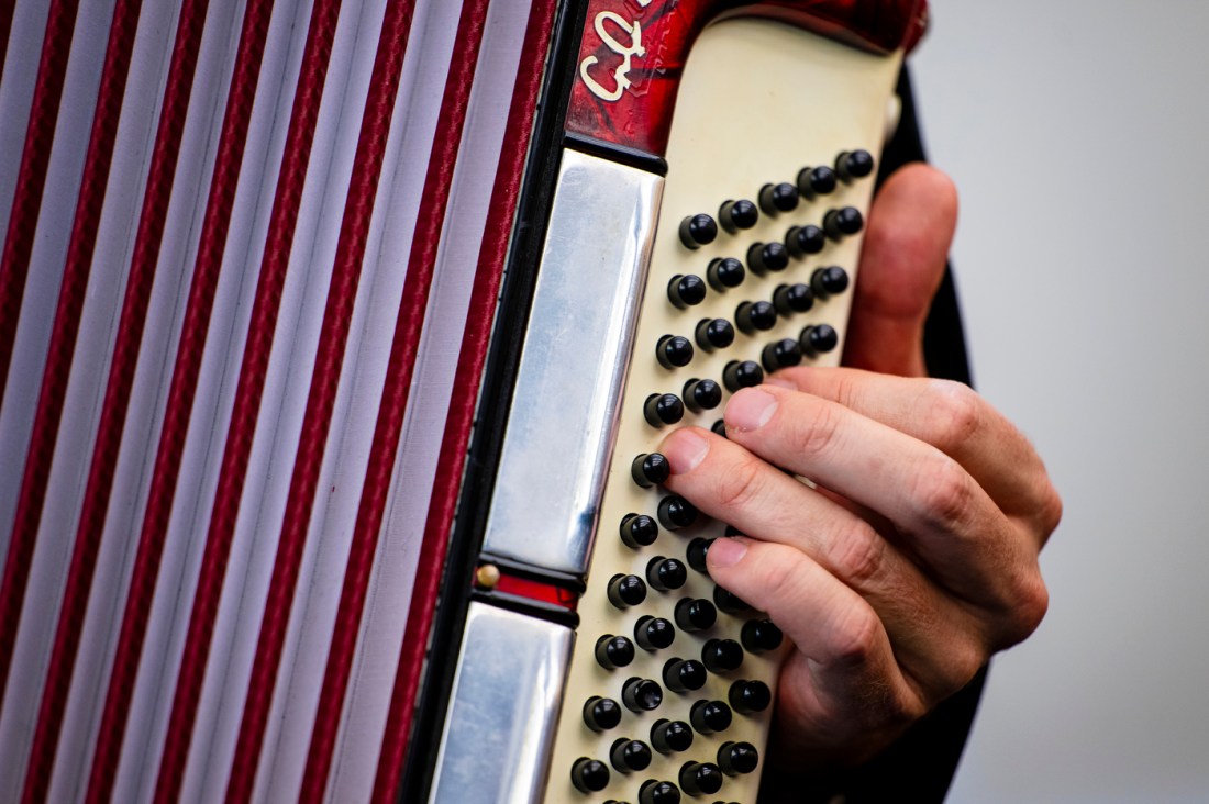 Neta Weiner playing an accordian.