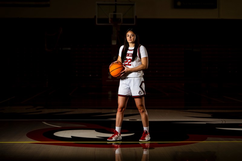 Maddie Vizza posing with a basketball