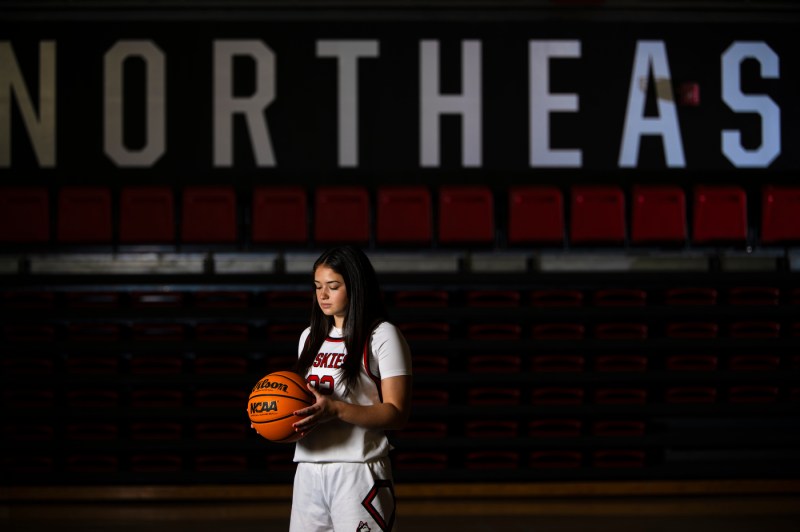 Maddie Vizza posing with a basketball