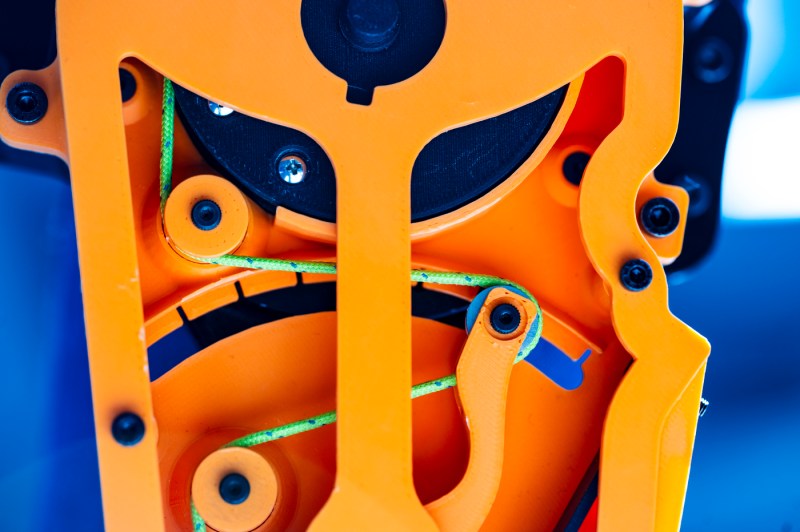 A closeup of the orange plastic exoskeleton.