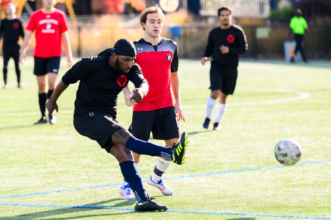 A soccer player taking a shot. 