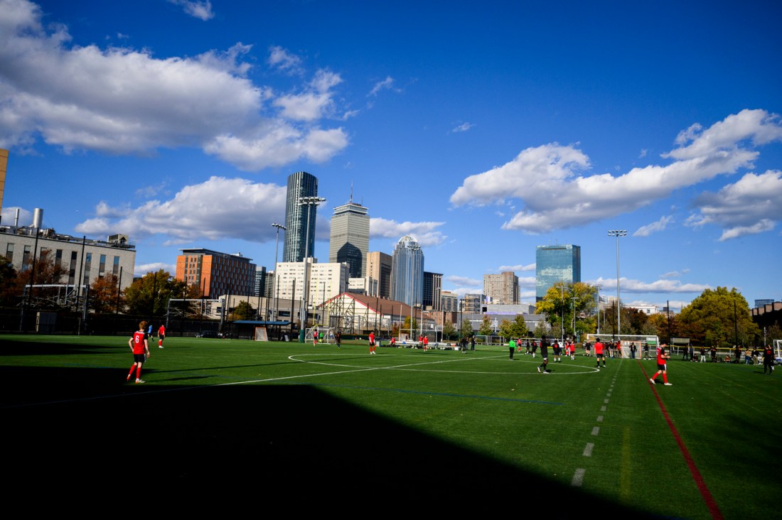 Roux club soccer team members playing soccer at Carter Field. 