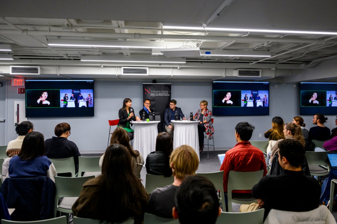 Mai'a Cross, Daniel Drezner, Dennis Kwok, and Maria Ivanova sitting around two tables at the State of the World series. 