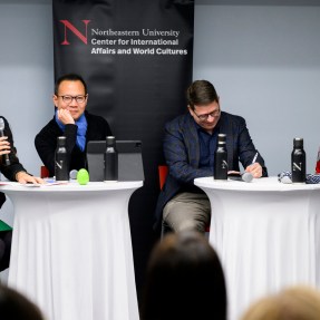 Mai'a Cross, Daniel Drezner, Dennis Kwok, and Maria Ivanova sitting around two tables at the State of the World series.