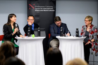 Mai'a Cross, Daniel Drezner, Dennis Kwok, and Maria Ivanova sitting around two tables at the State of the World series.