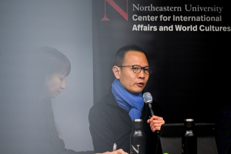 Dennis Kwok speaking into a microphone at the State of the World Series event.