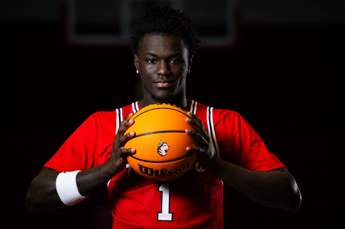 Masai Troutman posing with a basketball.