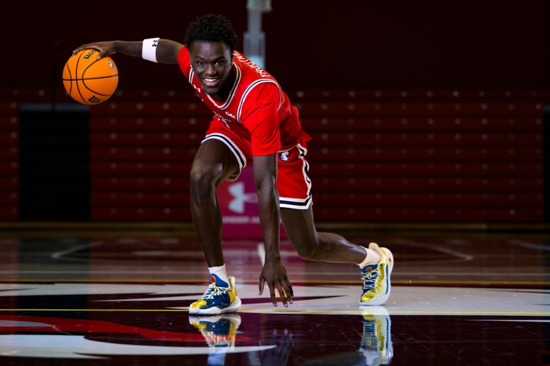 Masai Troutman posing with a basketball.