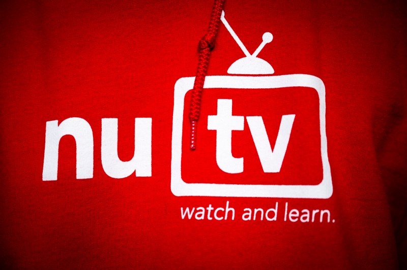 The NUTV logo on a red hoodie.