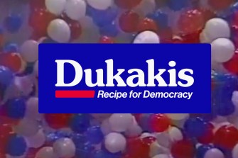 A banner saying 'Dukakis Recipe for Democracy'.