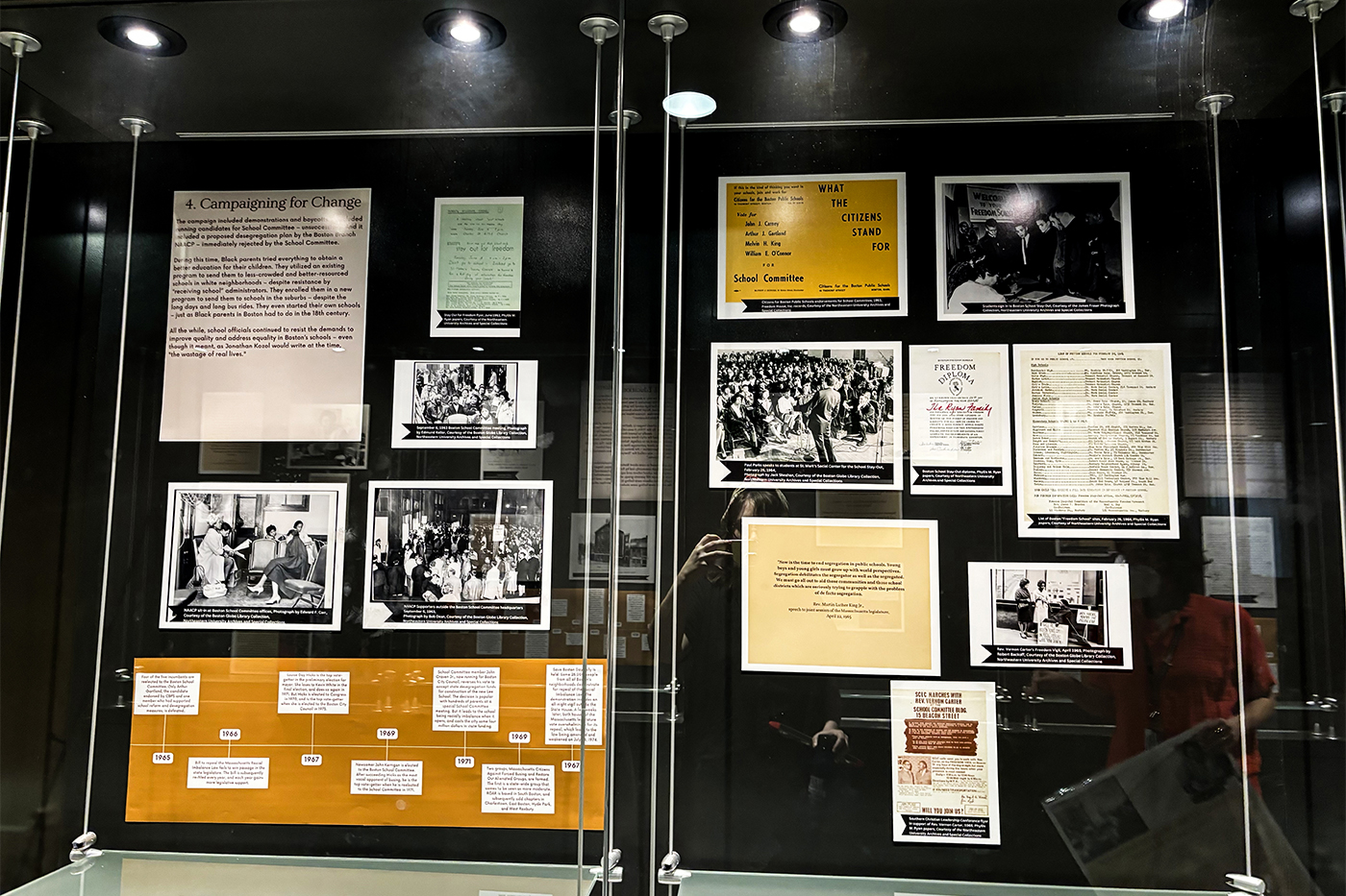 Archives displayed in a glass gallery wall. 