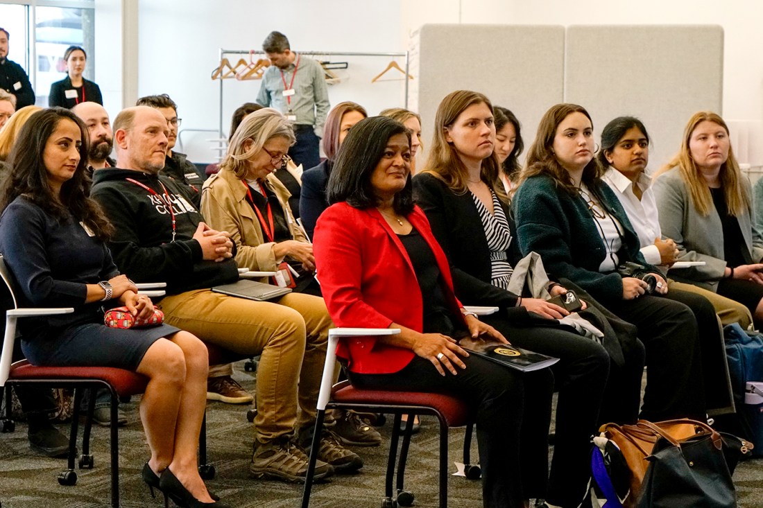 U.S. Rep. Pramila Jayapal sitting among audience members. 