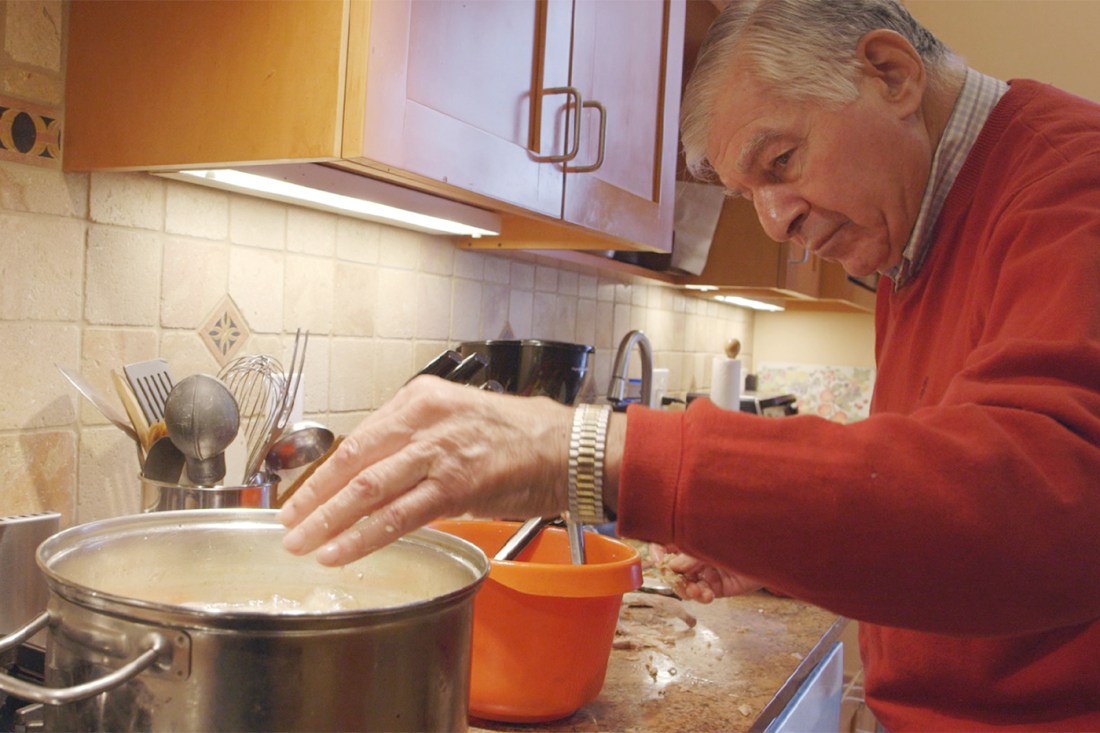 Michael Dukakis making rukey soup in his kitchen.