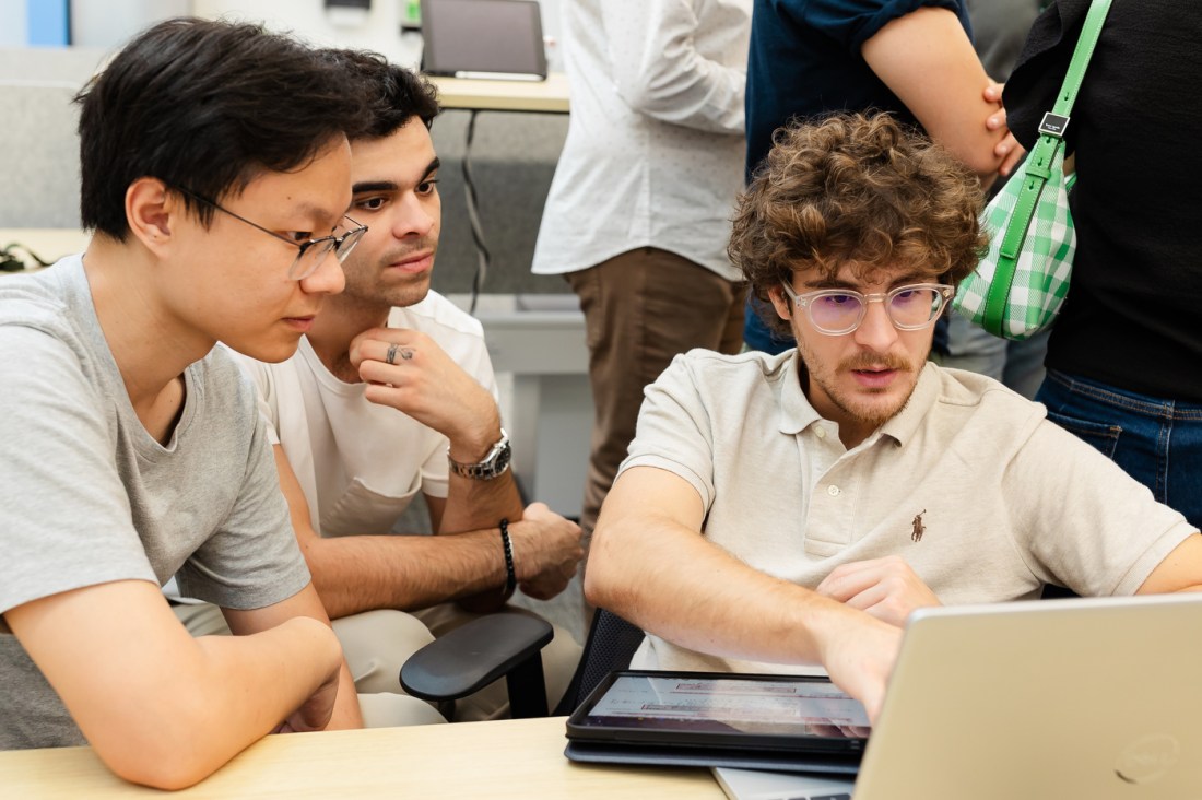 Researchers interact in the lab together.
