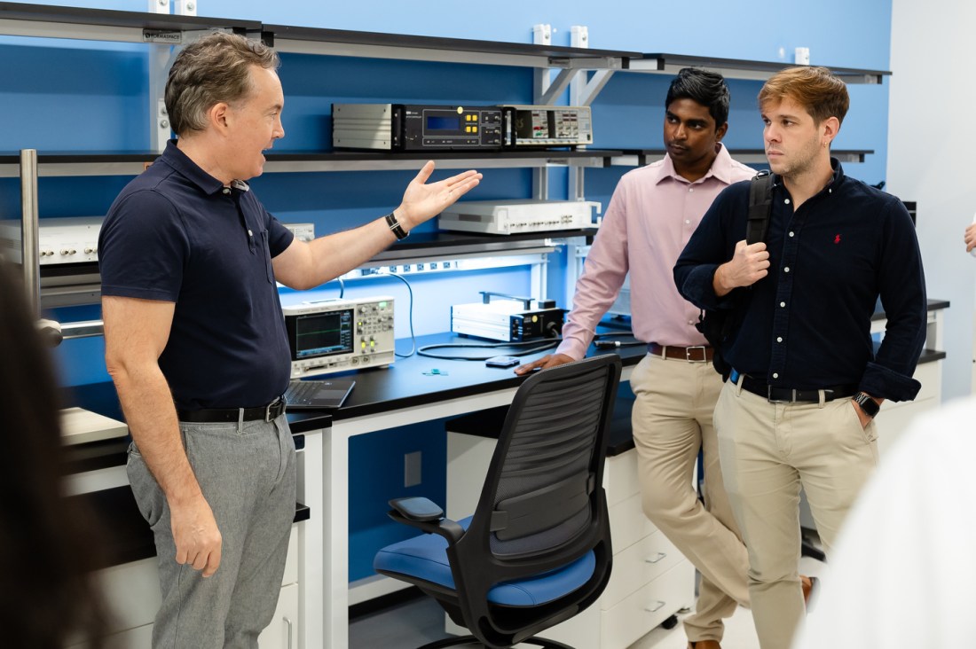 Individuals collaborate in a laboratory.