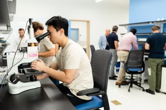 People work in a laboratory setting.