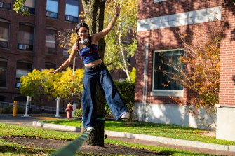 A student slack lining on campus.