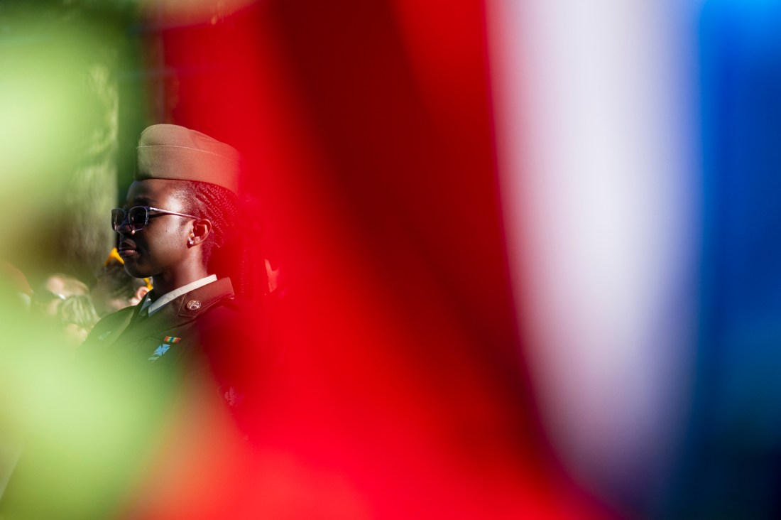 A Northeatern ROTC member standing outside.