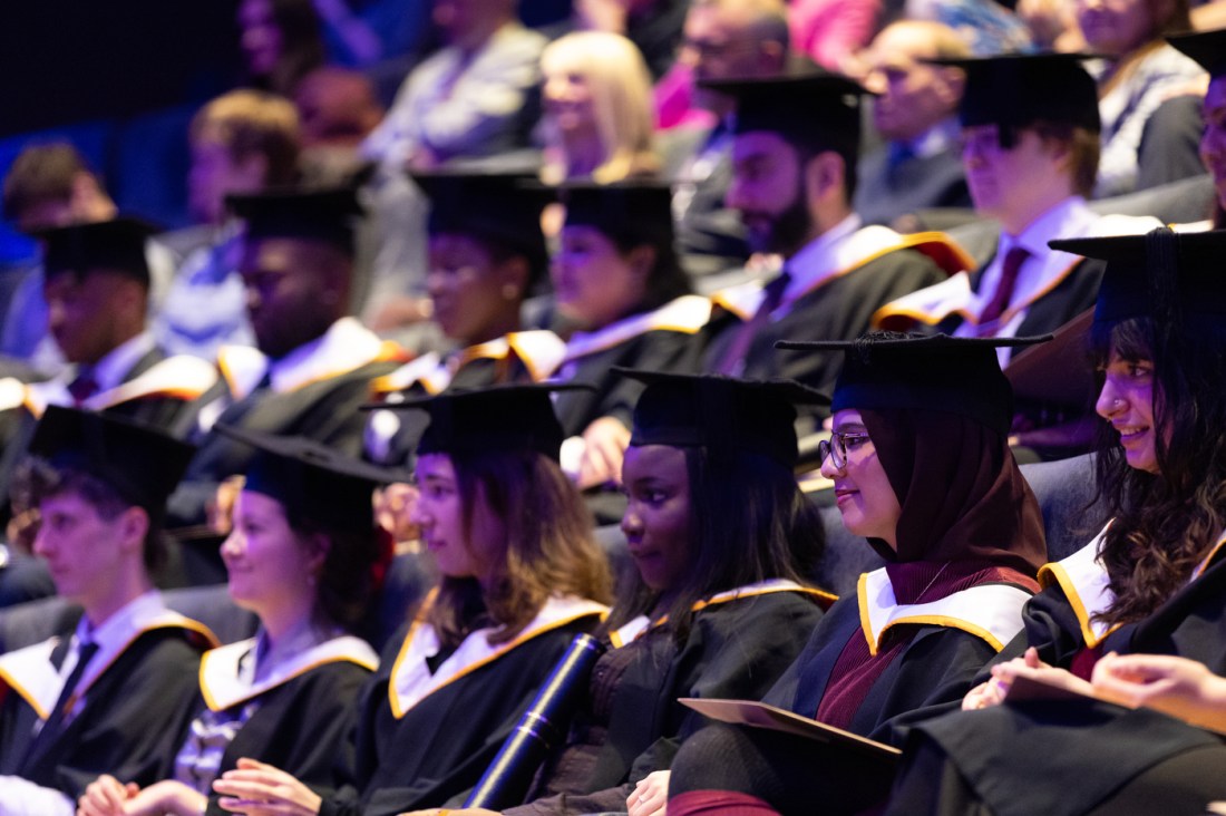 Rows of graduates at the Barbican Centre.