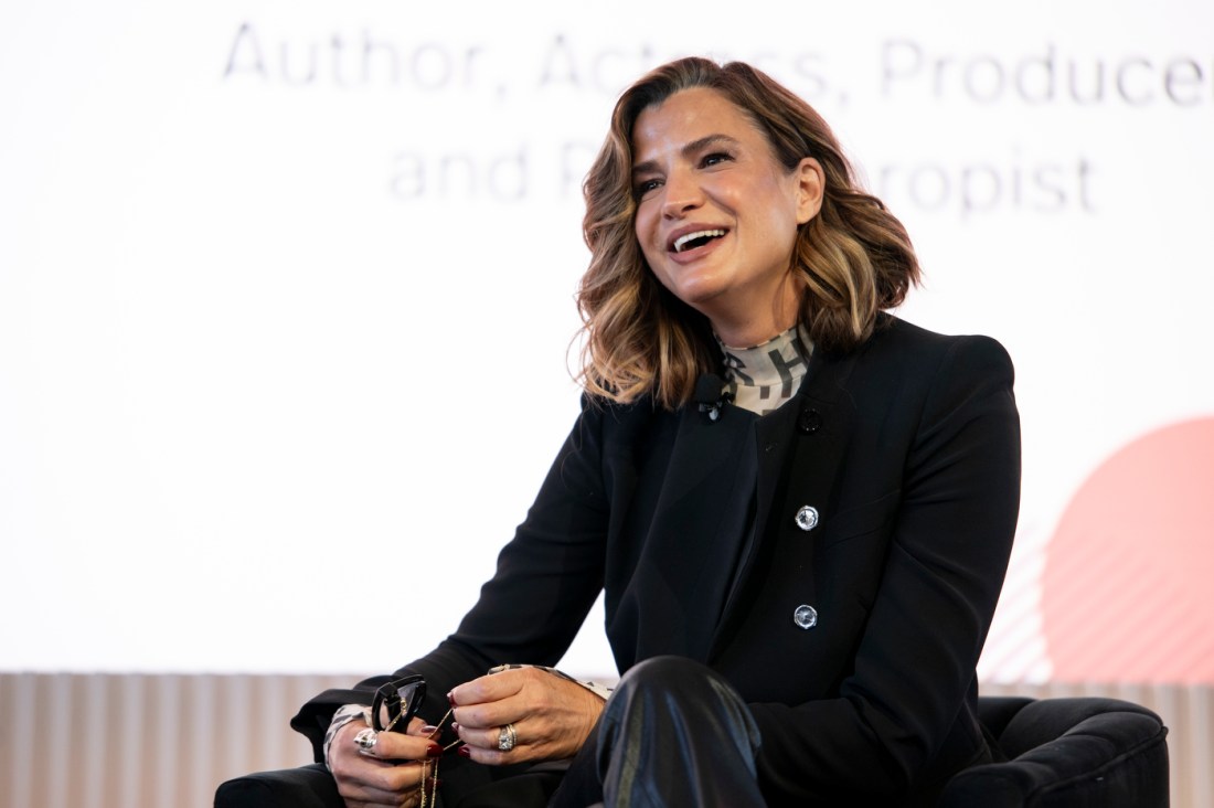 A speaker smiling at the Women Who Empower event.