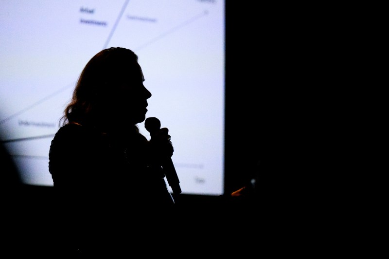 The silhouette of a person speaking at DMSB day.