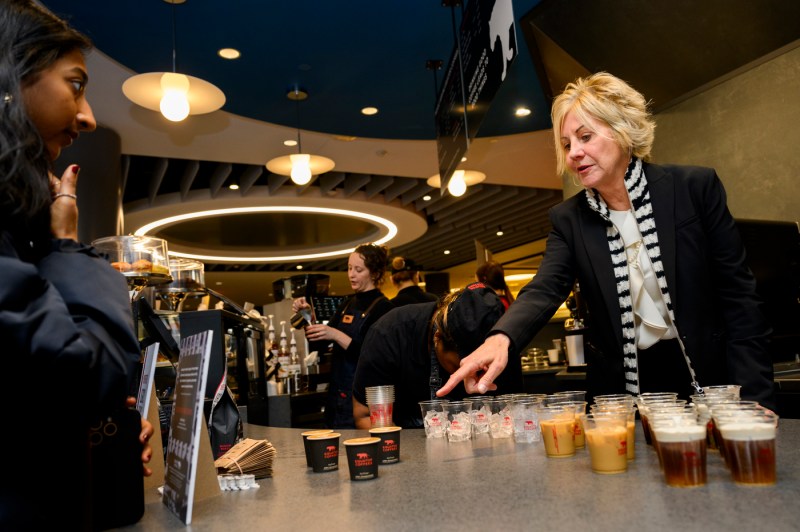 Helen Russell points at a cup of coffee.