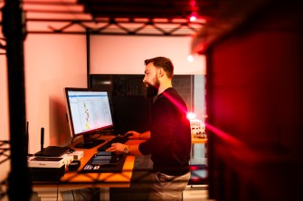 PhD student Evangelos Bitsikas working in a lab.