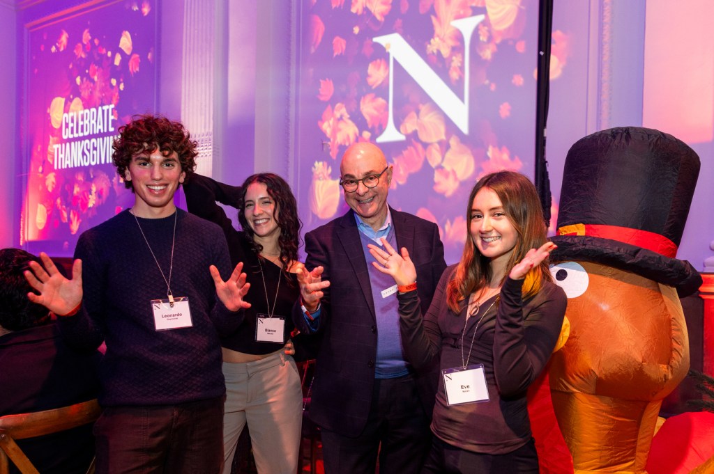 President Aoun with students at Northeastern's Thanksgiving dinner in Lindley Hall.