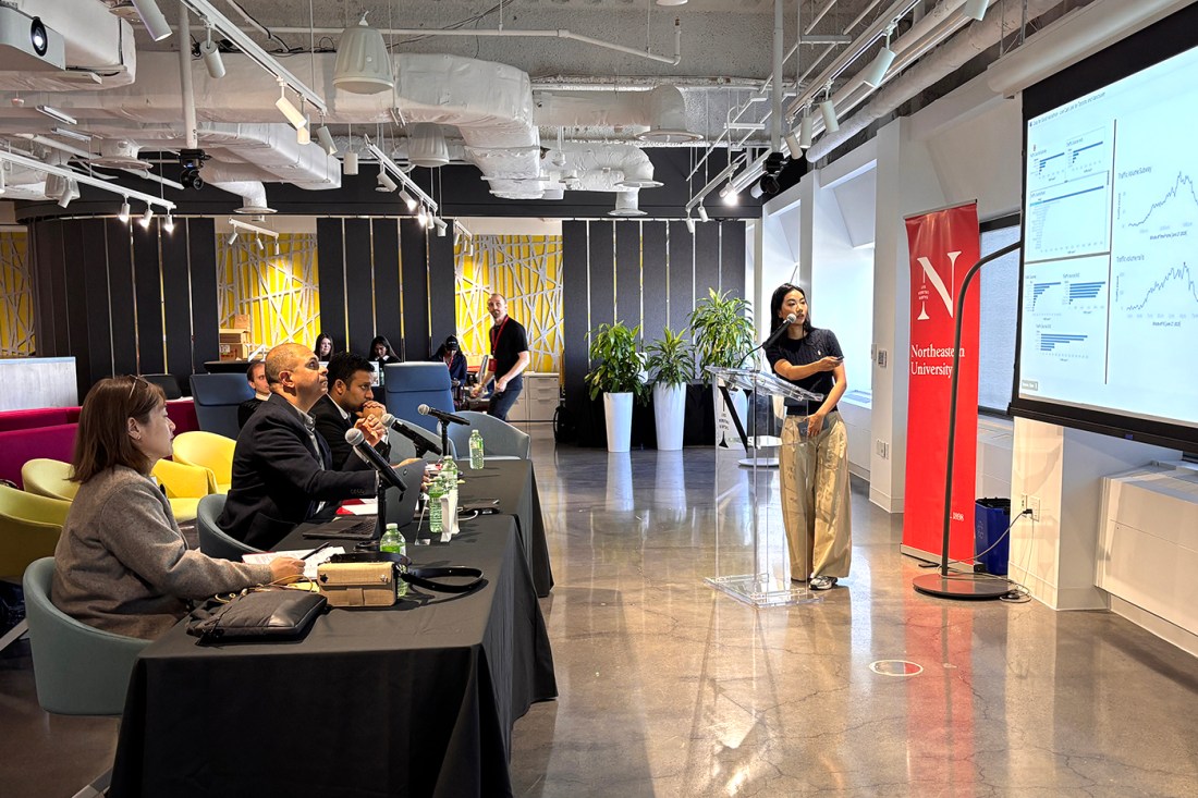 A student presenting at a hackathon.