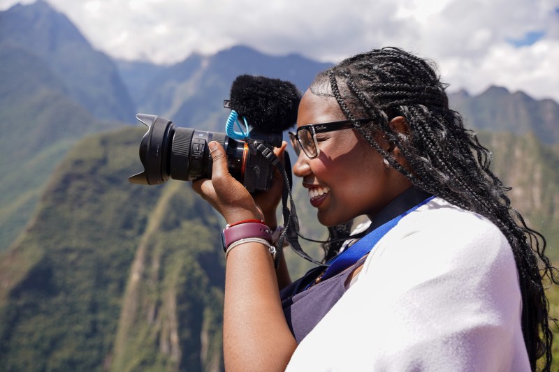 A person taking a photo on their camera.