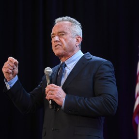 RFK Jr speaking into a microphone.