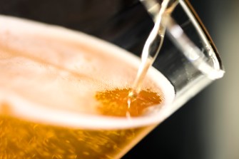 Beer being poured into a glass.