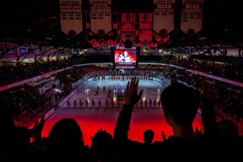 A crowd cheers from Northeastern's women's hockey team during the Women's Beanpot semifinal game against Boston College.