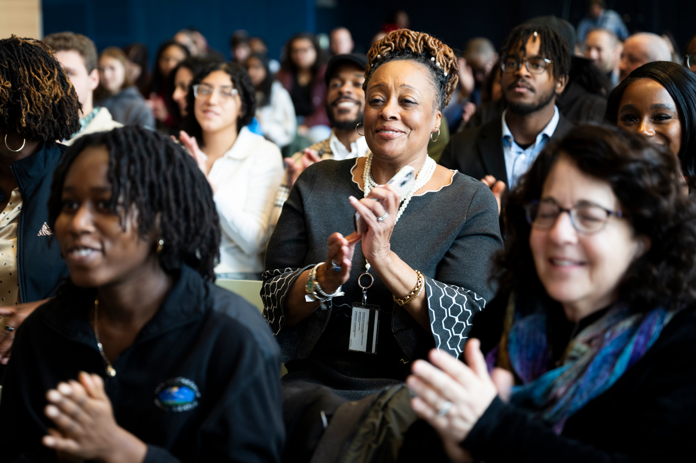 Audience members clapping at the MLK Jr event.