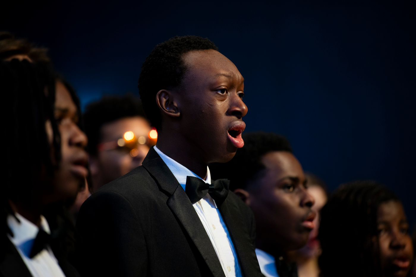 A singer from the Boston Arts Academy's Spiritual Ensemble singing at the MLK Jr event.