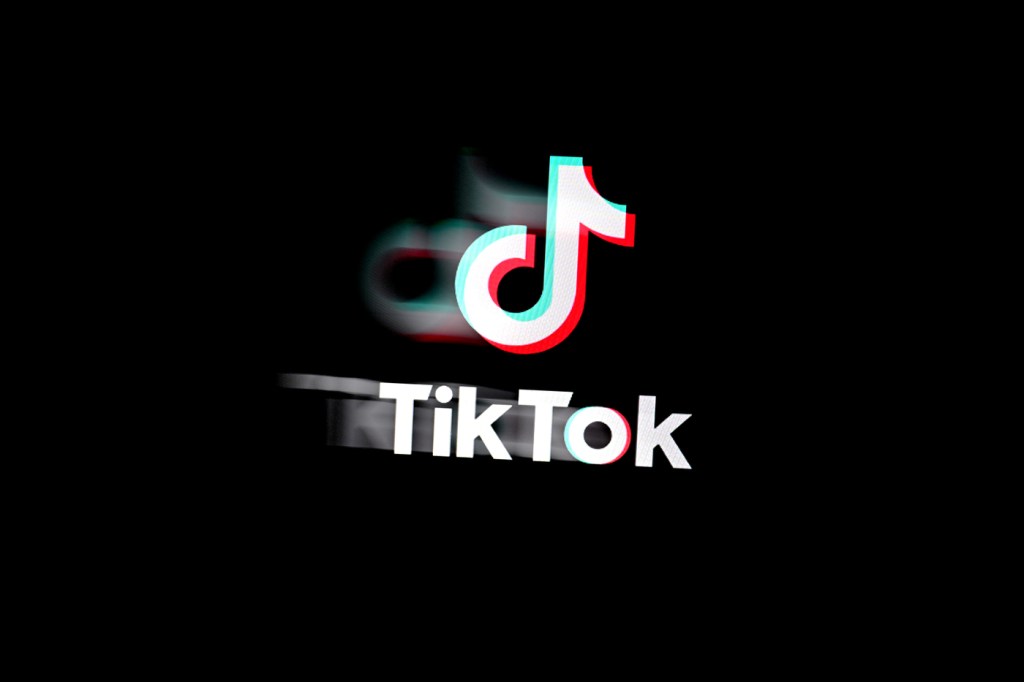 The TikTok logo featuring an iridescent musical note icon with the word 'TikTok' underneath on a black background.