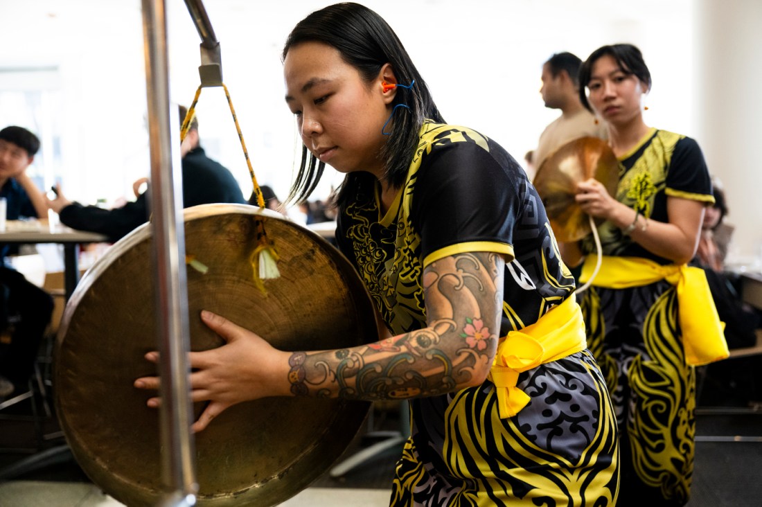 A musician plays a traditional drum during Northeastern's Lunar New Year celebration at the International Village.