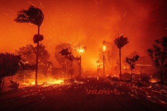 A landscape engulfed in smoke and flame.