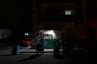 A generator powered lamp on a sidewalk in Puerto Rico.