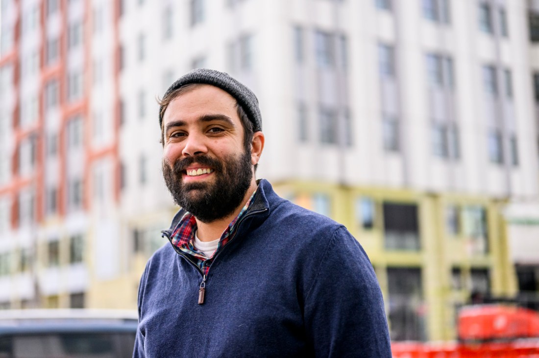 Portrai tof Josh Lown standing outside wearing a beanie and a sweater.