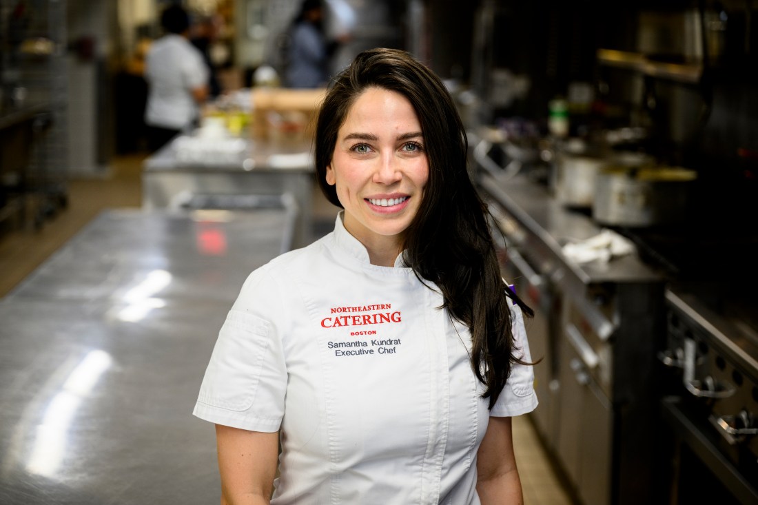 Portrait of Samantha Kundrat wearing a 'Northeastern Catering' white shirt with a collar. 