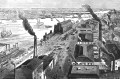 A black and white historical drawing of smoke rising out of chimneys and smoke stacks on buildings in St. Louis Missouri along the river.