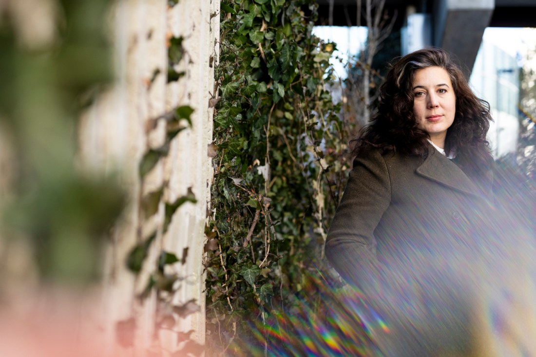 Portrait of Anncy, Thresher standing outside wearing a coat. 